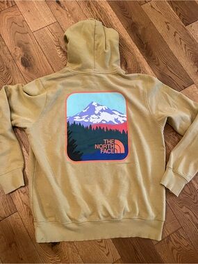 The North Face Yellow Pullover Hoodie with Mountain Graphic